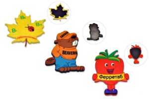 一組磁鐵，上面有一隻熊、一片葉子和一片楓葉。